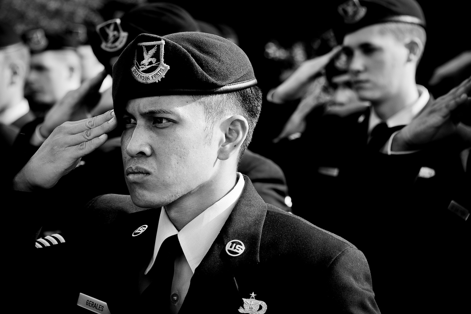 Staff Sgt. Rosenmark Gerales, a 96th Security Forces Squadron Airman, salutes during the national anthem at a remembrance and retreat ceremony at the All Wars Memorial May 17 at Eglin Air Force Base, Fla.  The ceremony formally closed Police Week activities. Chief of the Niceville Police Department, David Popwell, a former security forces Airman, was the guest speaker at the event.  During his speech, he donned the black beret to honor his fellow security forces Airmen still serving.  (U.S. Air Force photo/Samuel King Jr,)