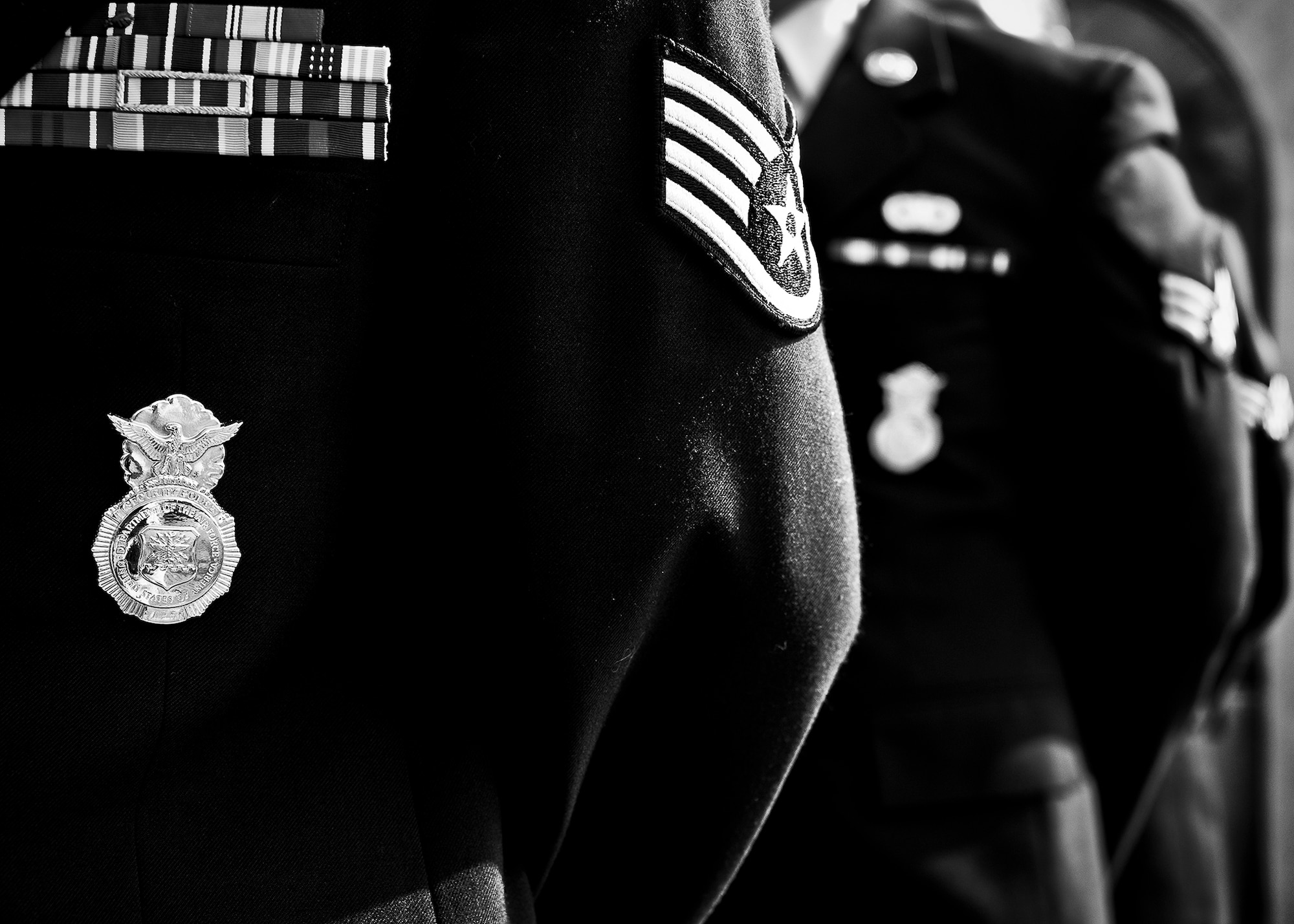 Airmen from the 96th Security Forces Squadron stand in formation during a remembrance and retreat ceremony at the All Wars Memorial May 17 at Eglin Air Force Base, Fla.  The ceremony formally closed Police Week activities. Chief of the Niceville Police Department, David Popwell, a former security forces Airman, was the guest speaker at the event.  During his speech, he donned the black beret to honor his fellow security forces Airmen still serving.  (U.S. Air Force photo/Samuel King Jr,)