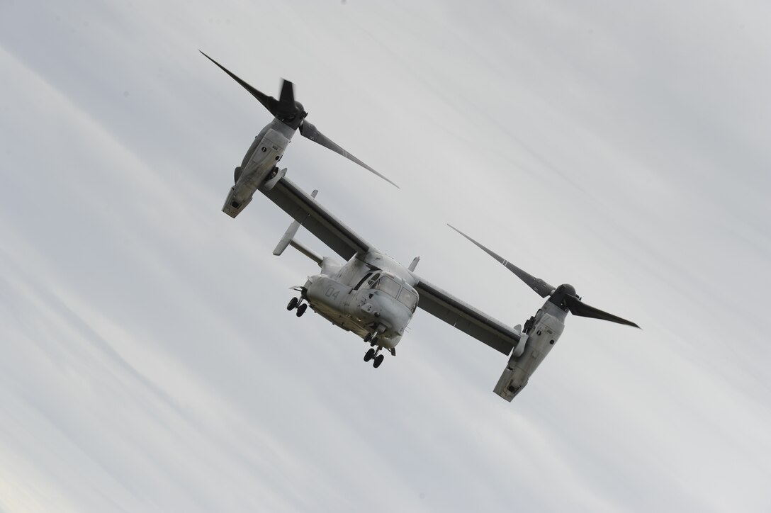 The U.S. Marine Corps V-22 Osprey hovers over the crowd at the 2012 Joint Service Open House May 20 on Joint Base Andrews, Md. This year's JSOH celebrates the Centennial of Marine Corps Aviation. The JSOH affords the public the opportunity to meet the men and women of the Armed Forces while viewing more than 100 static displays and 19 aerial demonstration teams. (U.S. Air Force photo by Staff Sgt. Christopher Ruano)