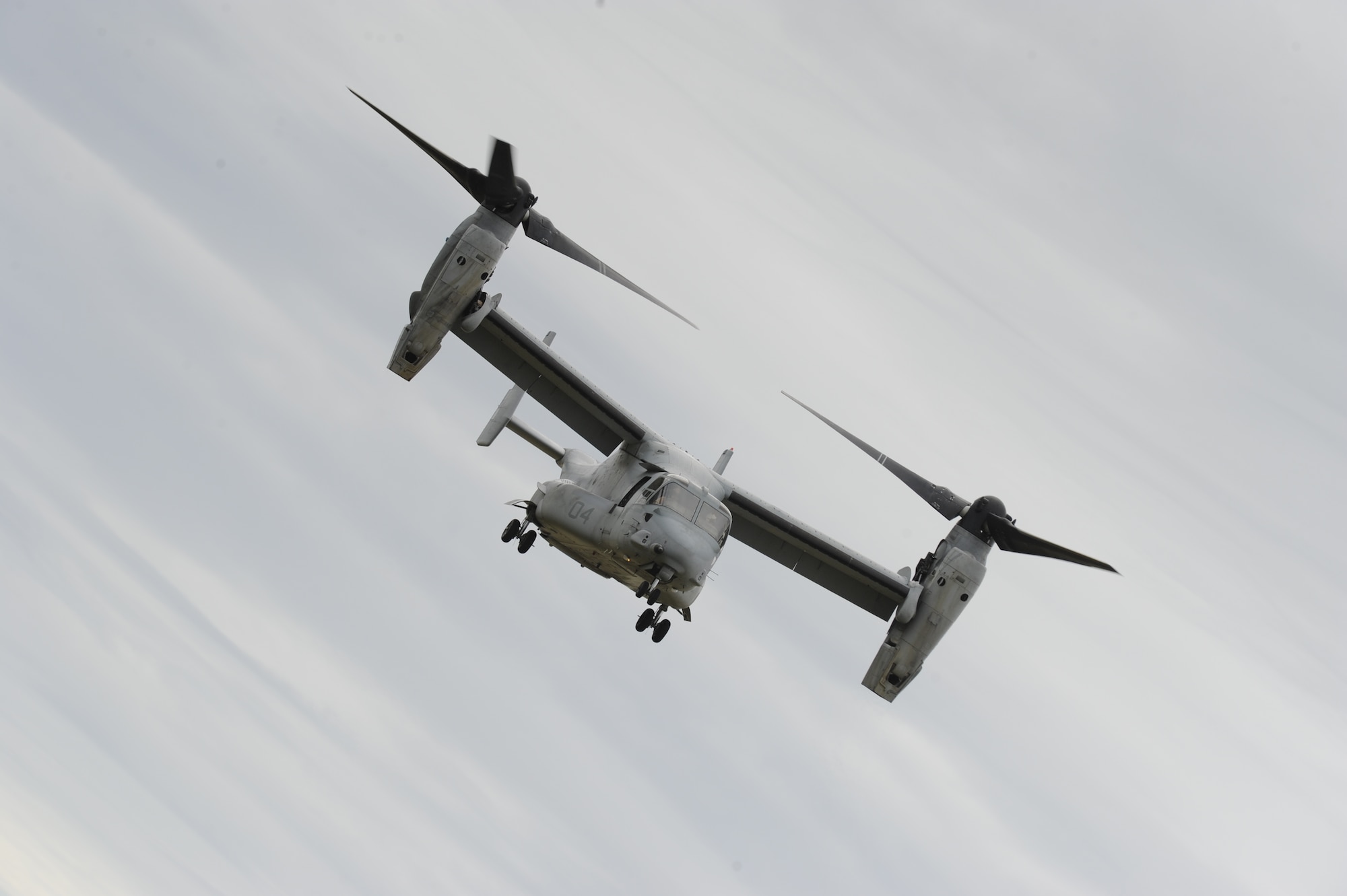 The U.S. Marine Corps V-22 Osprey hovers over the crowd at the 2012 Joint Service Open House May 20 on Joint Base Andrews, Md. This year's JSOH celebrates the Centennial of Marine Corps Aviation. The JSOH affords the public the opportunity to meet the men and women of the Armed Forces while viewing more than 100 static displays and 19 aerial demonstration teams. (U.S. Air Force photo by Staff Sgt. Christopher Ruano)