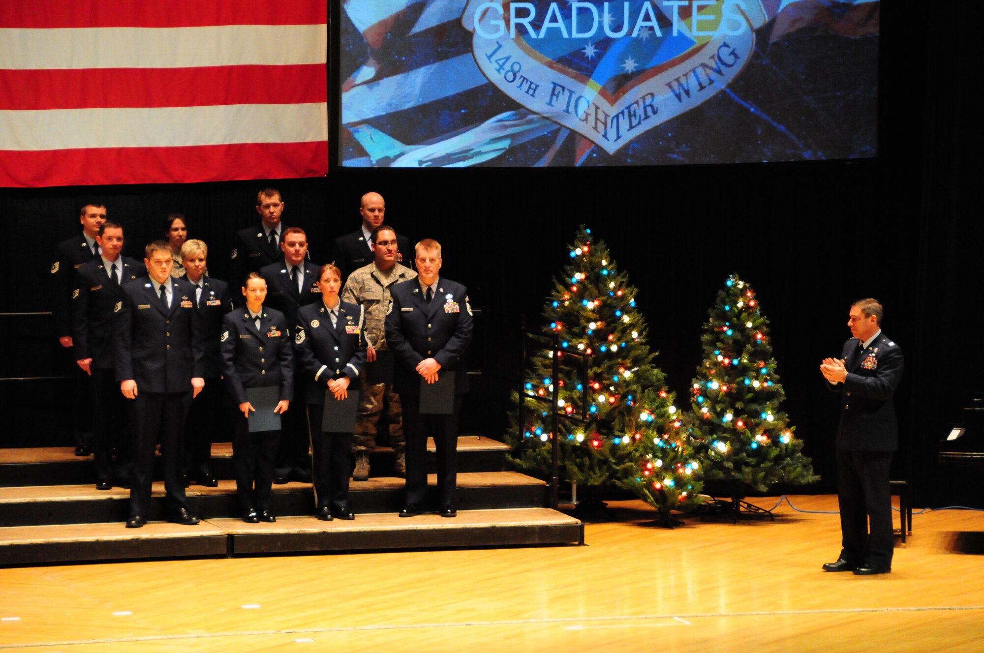 148th Fighter Wing Community College of the Air Force graduates stand during the 2011 award and retirement ceremony at the Duluth Entertainment Convention Center Dec. 4, 2011.  From 2010 to 2011, CCAF graduates have increased 59%. That number is expected to increase for the 148th again in the 2012 graduating classes.  (National Guard photo by Senior Airman Sarah Hayes.)