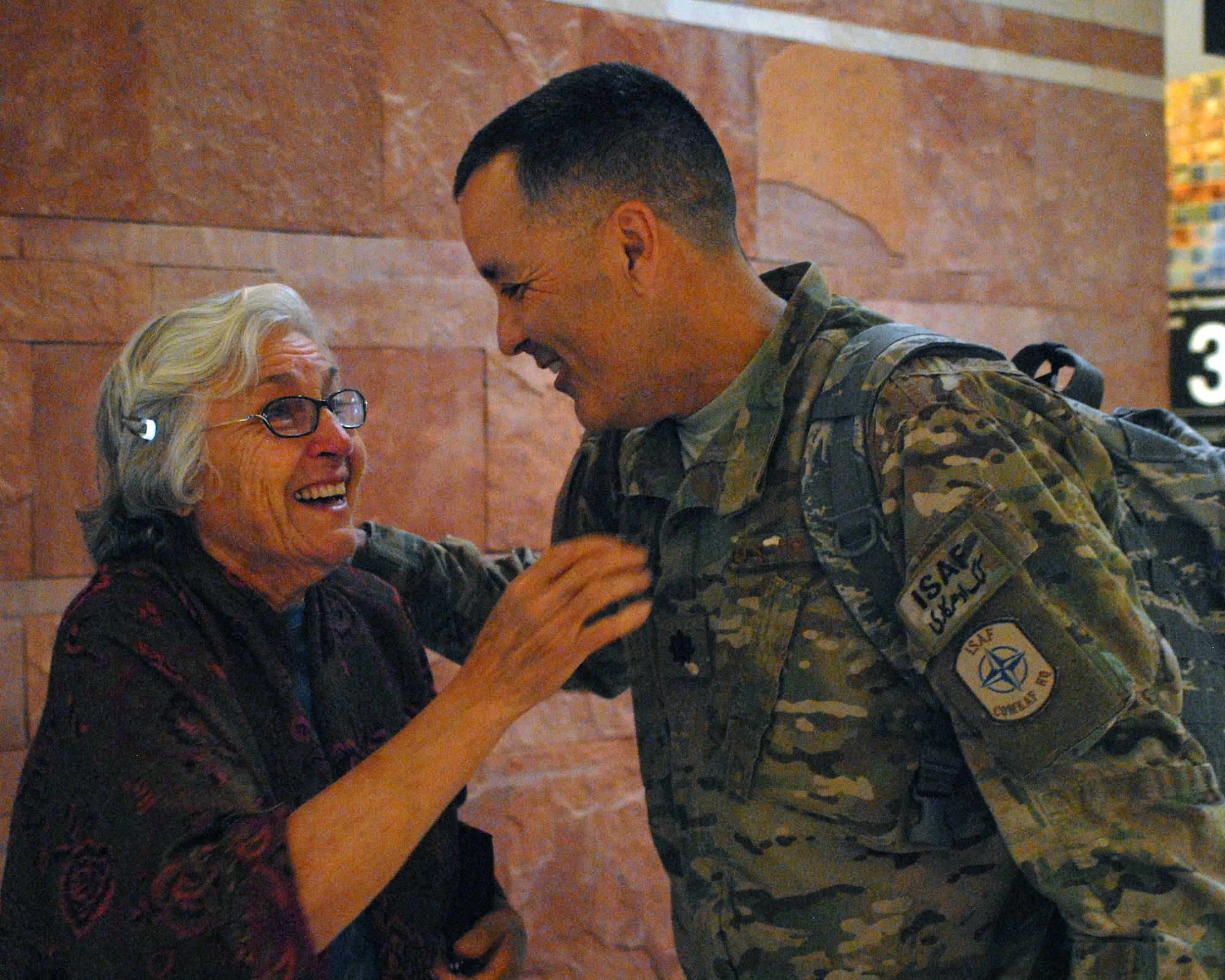 Maria Aguirre tears up as she sees her son, Lt. Col. Paul Aguirre, for the first time after his seven-month deployment to Kandahar, Afghanistan. Colonel Aguirre, who is the chief of staff with the 161st Air Refueling Wing, was greeted May 6, 2012, by friends and family at Phoenix Sky Harbor International Airport. (U.S. Air Force photo by Tech. Sgt. Susan Gladstein/Released)