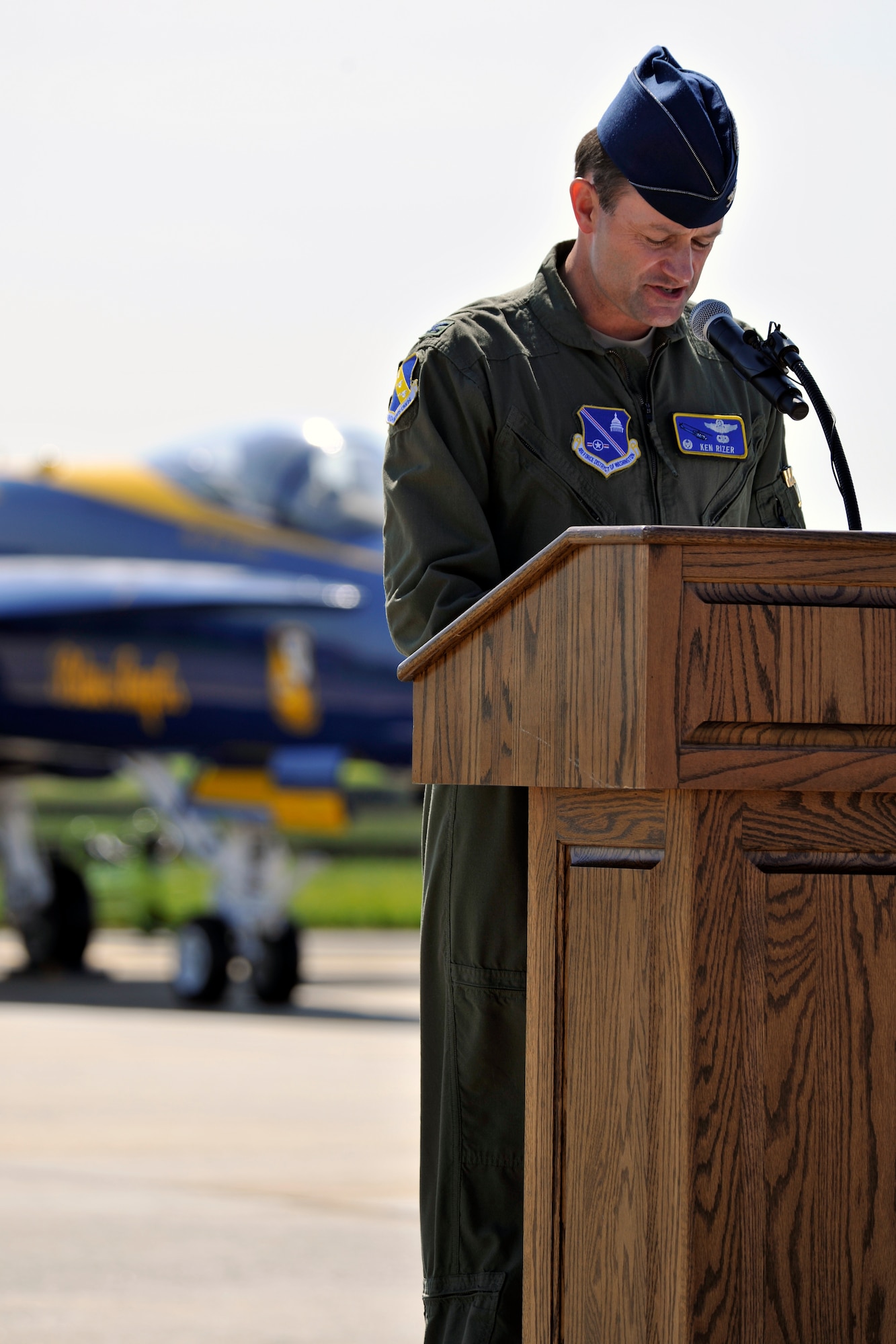 Col. Ken Rizer, 11th Wing/Joint Base Andrews commander, speaks during the opening ceremony of the 2012 Joint Service Open House, May 19 at Joint Base Andrews, Md. This year's Joint Service Open House celebrates the Centennial of Marine Corps Aviation. JSOH affords the public the opportunity to meet the men and women of the Armed Forces while viewing more than 100 static displays and 19 aerial demonstration teams.(U.S. Air Force photo by Senior Airman Perry Aston)