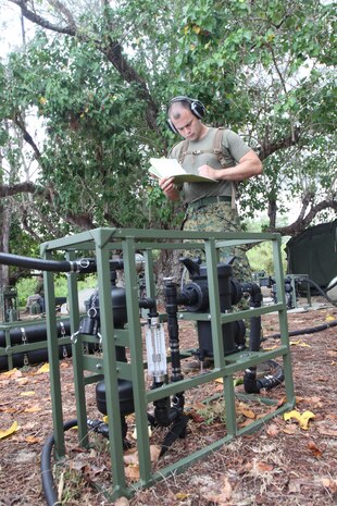 TINIAN, Commonwealth of the Northern Mariana Islands — Lance Cpl. Fabian A. Gomezortiz, Marine Wing Support Squadron 171, Marine Aircraft Group 12, water purification technician, records the activities of the light-weight purification system May 21 during exercise Geiger Fury 2012.