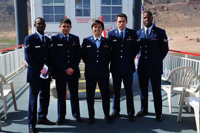 U.S Air Force Airman 1st Class Perez Oppong, 99th Medical Support Group pharmacy technican, Airman 1st Class Pedro Orozco, Airman 1st Class Sharmae Bernardo, and Airman 1st Class Onesimo Vasquez, 99th Dental Squadron dental assistants, and Senior Airman Loren King, 99th MDSG pharmacy technician, pose for a group photo after obtaining their United States citizenship May 18, 2012, at Lake Mead, Nev. At the ceremony, they joined 19 others gaining citizenship of the country these Airmen serve.  (U.S. Air Force photo by Airman 1st Class Christopher Tam)