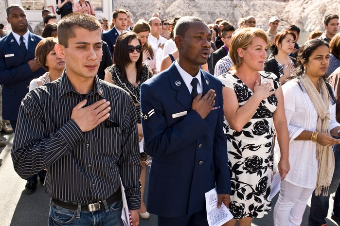 Air Force members and others recite the Pledge of Allegiance during a naturalization ceremony May 18, 2012, at Lake Mead, Nev. The Pledge of Allegiance was first published in 1892 in The Youth's Companion. (U.S. Air Force photo by Airman 1st Class Matthew Lancaster)