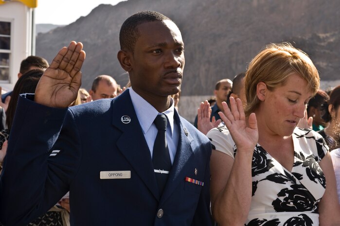 U.S. Air Force Airman 1st Class Perez Oppong, 99th Medical Support Group pharmacy technican, takes the Oath of Allegiance during a naturalization ceremony May 18, 2012, at Lake Mead, Nev. U.S. Citizenship and Immigration Services, National Park Services, and the Boulder City High School National Honor Society hosted the naturalization ceremony on Lake Mead for the first time. (U.S. Air Force photo by Airman 1st Class Matthew Lancaster)