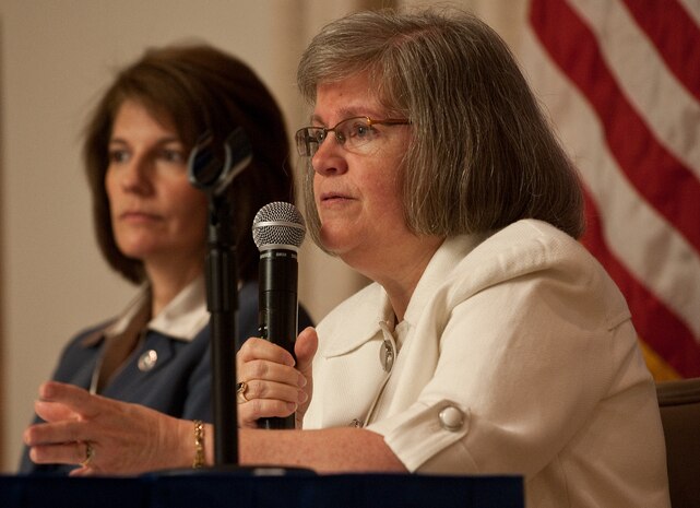 Catherine Cortez Masto (left), Nevada attorney general, and Holly Petraeus (right), Consumer Financial Protection Bureau servicemember affairs director, brief Airmen on ways to defend against financial scams during a town hall meeting May 16, 2012, at Nellis Air Force Base, Nev. Topics of discussion included identity theft, mortgage and foreclosure fraud, and payday loans. (U.S. Air Force photo by Staff Sgt. Christopher Hubenthal)