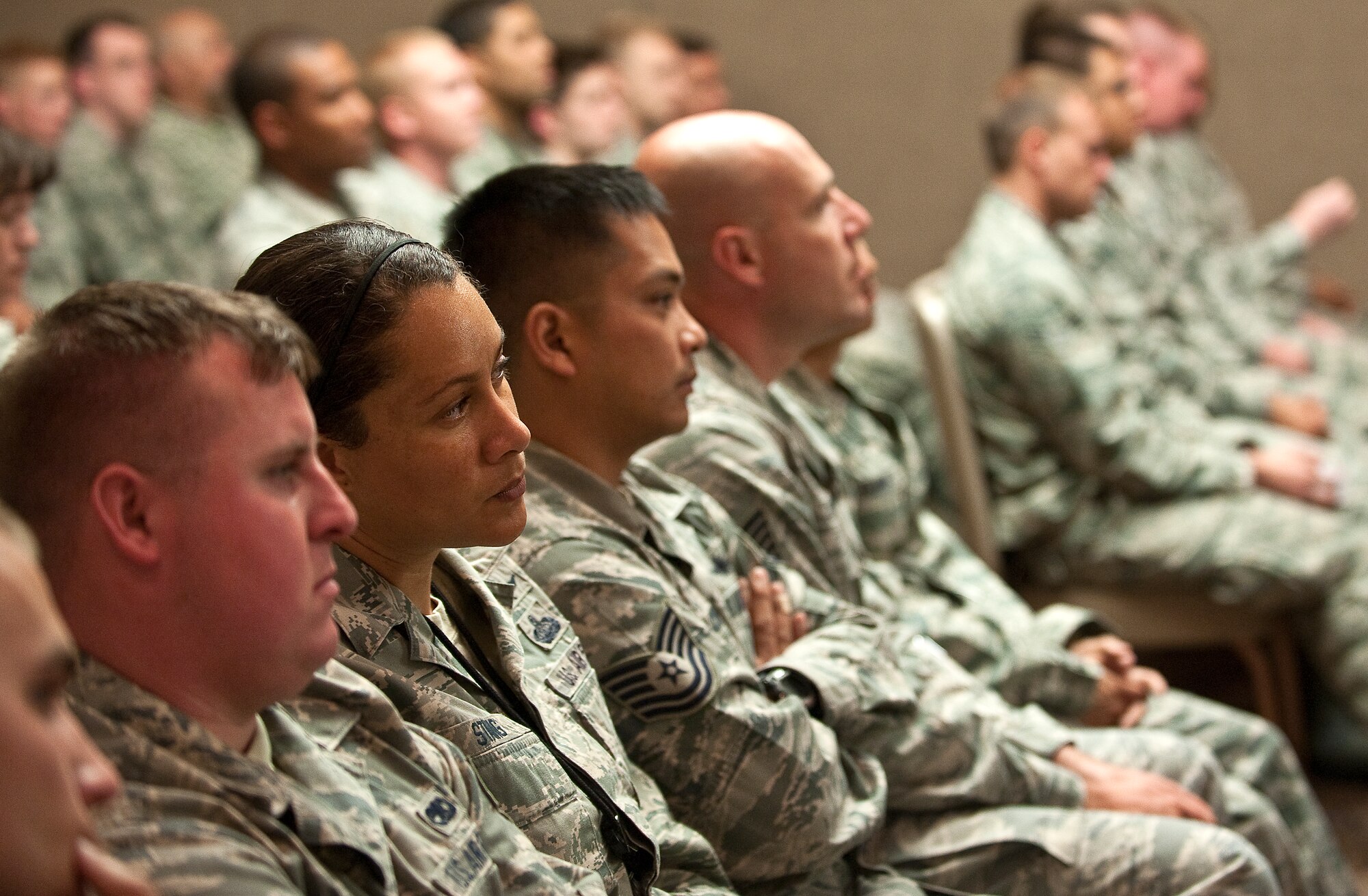 Airmen listen to a briefing given by Catherine Cortez Masto, Nevada attorney general, and Holly Petraeus, Consumer Financial Protection Bureau servicemember affairs director, during a town hall meeting May 16, 2012, at Nellis Air Force Base, Nev. Masto and Cortez came to Nellis to learn about financial issues Airmen have been facing and educate Airmen about consumer and financial scams they could encounter. (U.S. Air Force photo by Staff Sgt. Christopher Hubenthal)