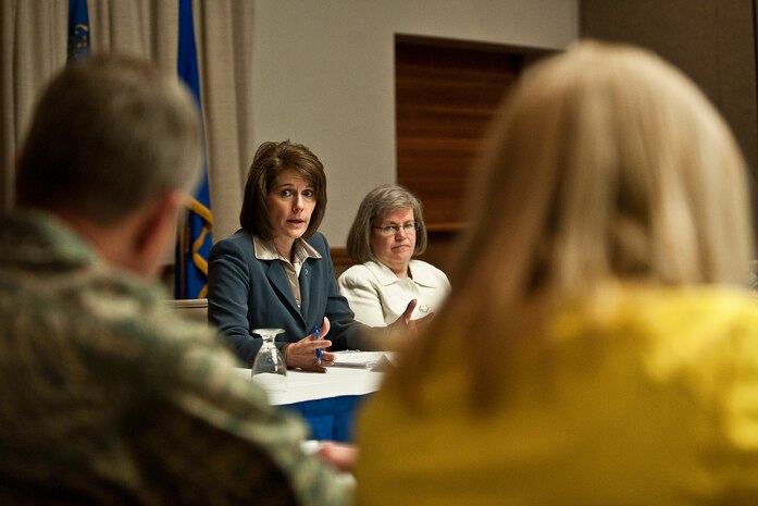Catherine Cortez Masto (left center), Nevada attorney general, and Holly Petraeus (right center), Consumer Financial Protection Bureau servicemember affairs director, brief first sergeants and base senior leaders on ways to protect Airmen from financial scams during a town hall meeting May 16, 2012, at Nellis Air Force Base, Nev. Masto and Petraeus came to Nellis AFB to find out what financial problems Airmen have been facing recently. (U.S. Air Force photo by Staff Sgt. Christopher Hubenthal)