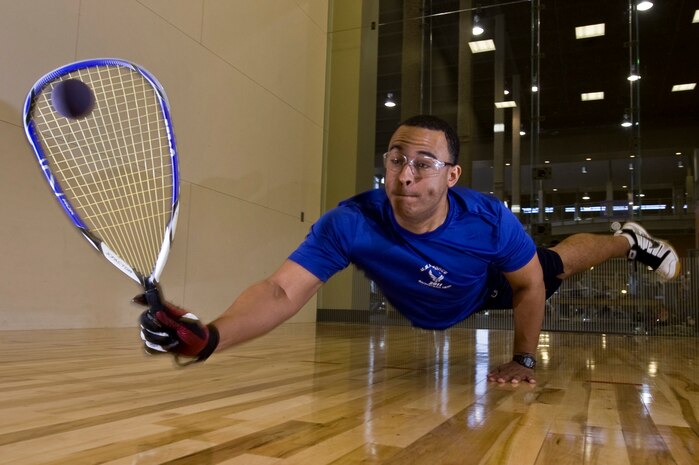 U.S. Air Force 2nd Lt. Maurice Mckoy, 99th Comptroller Squadron financial officer, dives to hit the raquetball May 17, 2012, at Nellis Air Force Base, Nev. McKoy has been playing competitive racquet ball for more than 12 years and was hand-picked by the chief of Air Force sports to represent the Air Force in the 45th National Racquetball Singles Championship in Fullerton, CA. (U.S. Air Force photo by Airman 1st Class Daniel Hughes)

