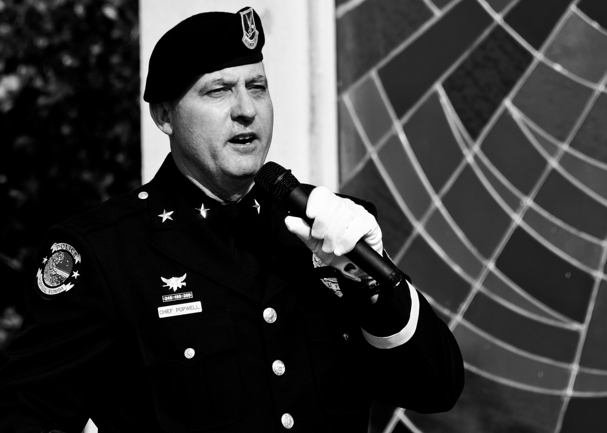 Chief of the Niceville Police Department, David Popwell, speaks to a formation of Airmen from the 96th Security Forces Squadron during a remembrance and retreat ceremony at the All Wars Memorial May 17 at Eglin Air Force Base, Fla.  The ceremony formally closed Police Week activities.  Popwell, a former security forces Airman, was the guest speaker at the event.  During his speech, he donned the Air Force security force’s black beret to honor his fellow Airmen still serving.  (U.S. Air Force photo/Samuel King Jr,)