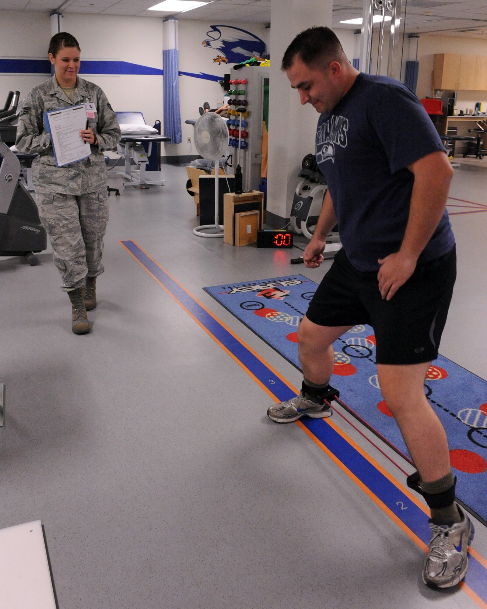 U.S. Air Force Staff Sgt. Andrew Kelp, 355th Equipment Maintenance Squadron, performs leg stretches for his physical therapy at the Physical Therapy Clinic on Davis-Monthan Air Force Base, Ariz., May 16, 2021. (U.S. Air Force photo by Airman 1st Class Christine Griffiths/Released) 
