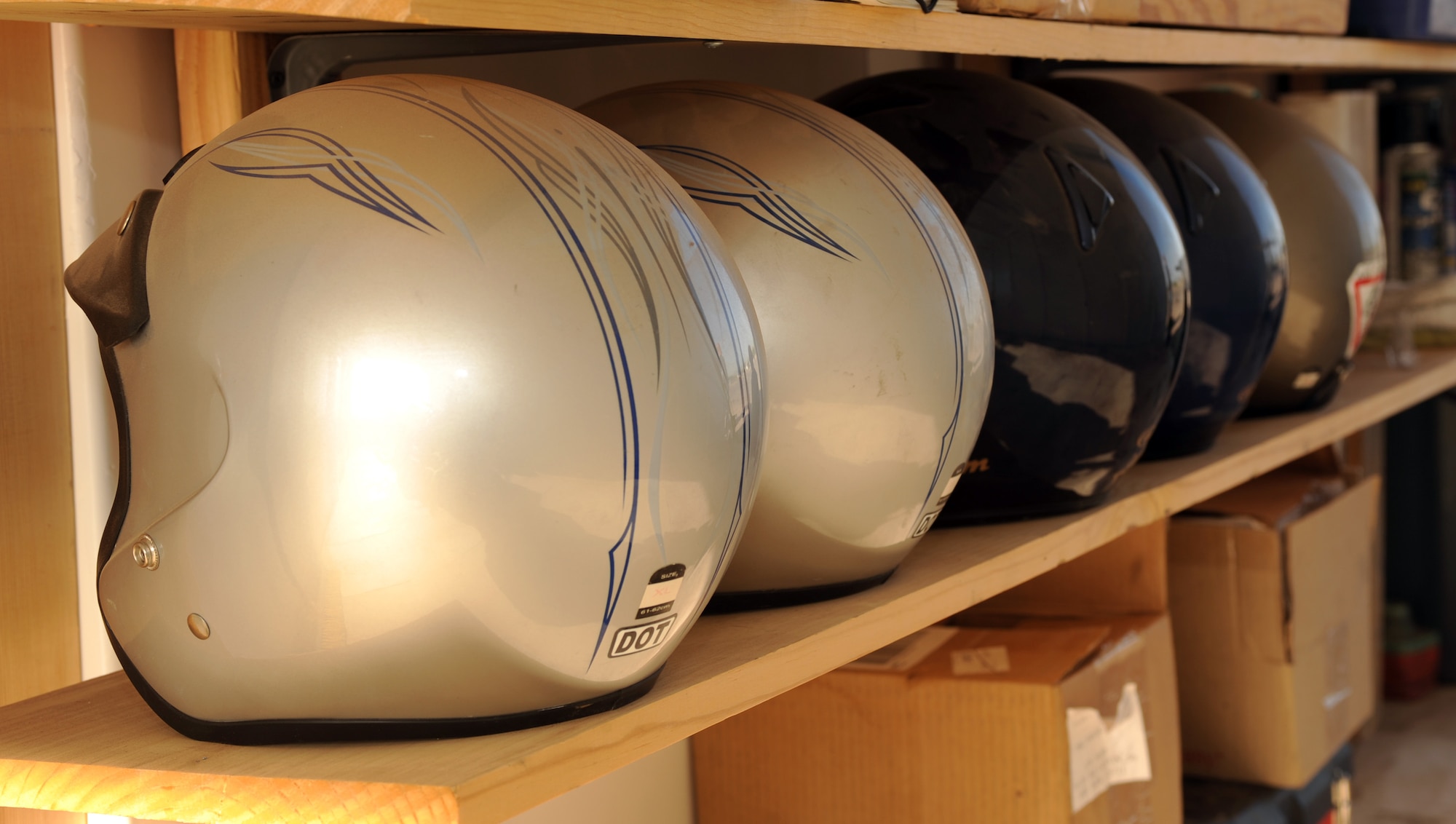 Helmets sit on a shelf in a storage unit on Davis-Monthan Air Force Base, Ariz., May 8, 2012. The helmets are used for students in the Motorcycle Safety Basic Rider Course that do not have a helmet of their own. (U.S. Air Force photo by Airman 1st Class Timothy D. Moore/Released)