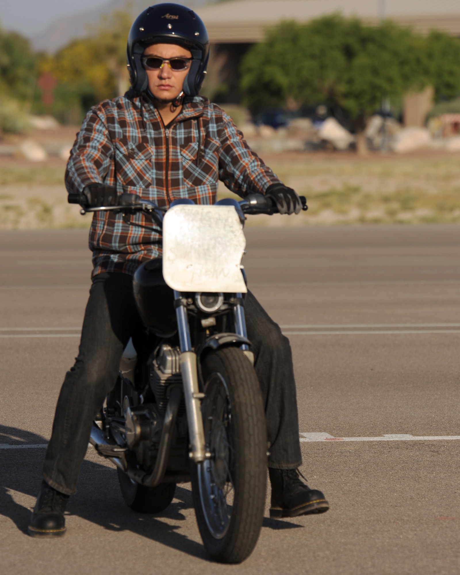 Herman Castillo, 309th Aircraft Maintenance and Regeneration Group, waits to practice techniques he has learned in the Motorcycle Safety Basic Rider Course on Davis-Monthan Air Force Base, Ariz., May 8, 2012. Castillo and other riders who wish to ride motorcycles on D-M are required to take the three-day course. (U.S. Air Force photo by Airman 1st Class Timothy D. Moore/Released)
