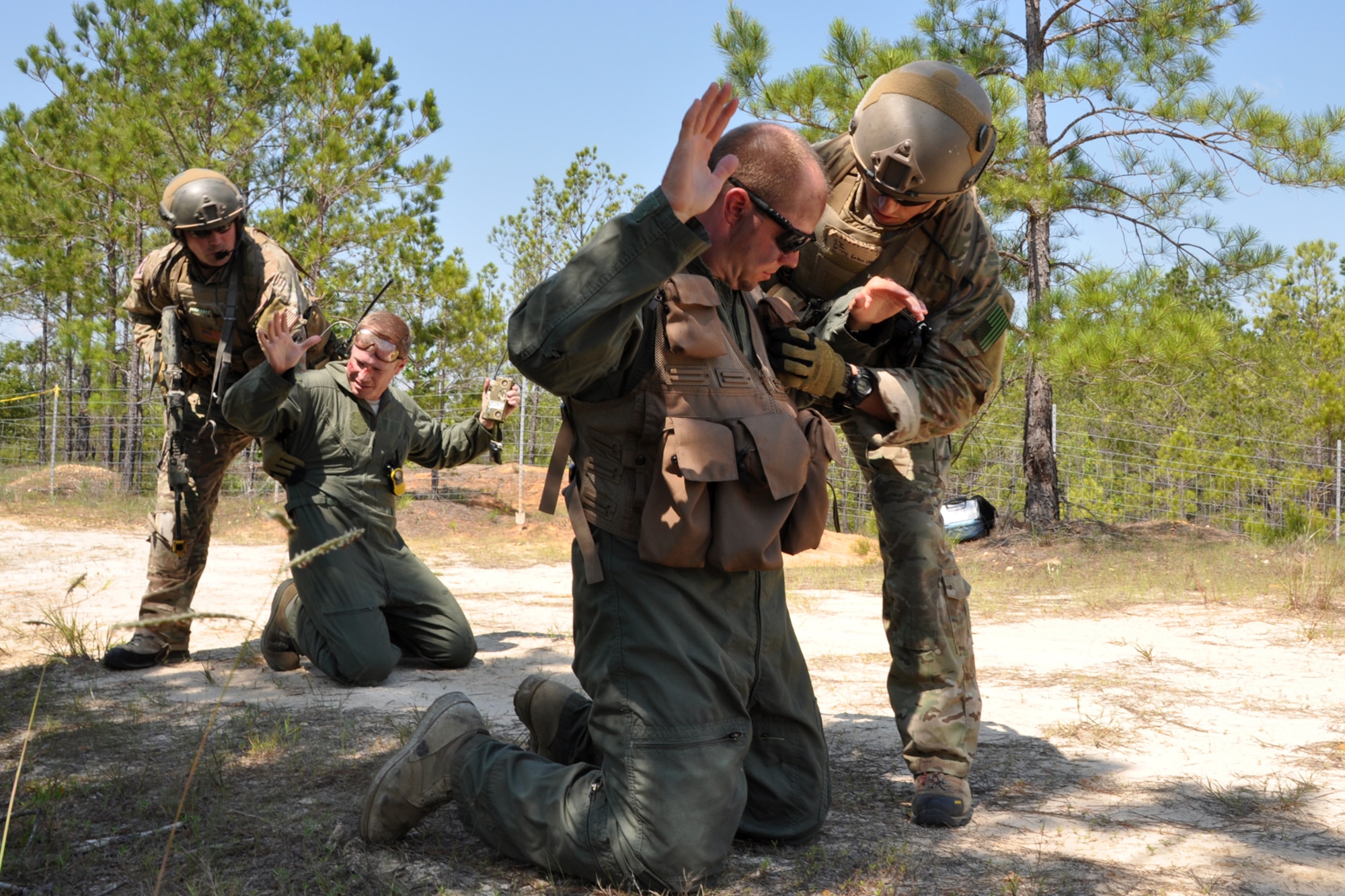 Parareascuemen from the 920th Rescue Wing at Patrick Air Force Base, Fla., authenticate the pilot and co-pilot of a downed C-130 during the mass casualty phase of the Patriot Saint exercise at Fort Polk, La., May 17, 2012. The goal of the exercise was to challenge pararescuemen to successfully execute combat search and rescue (CSAR) missions in real time while tactically solving enroute, fuel, communication, and OPFOR (Opposing Force) hurdles. (U.S. Air Force photo by Master Sgt. Jeff Walston/Released)