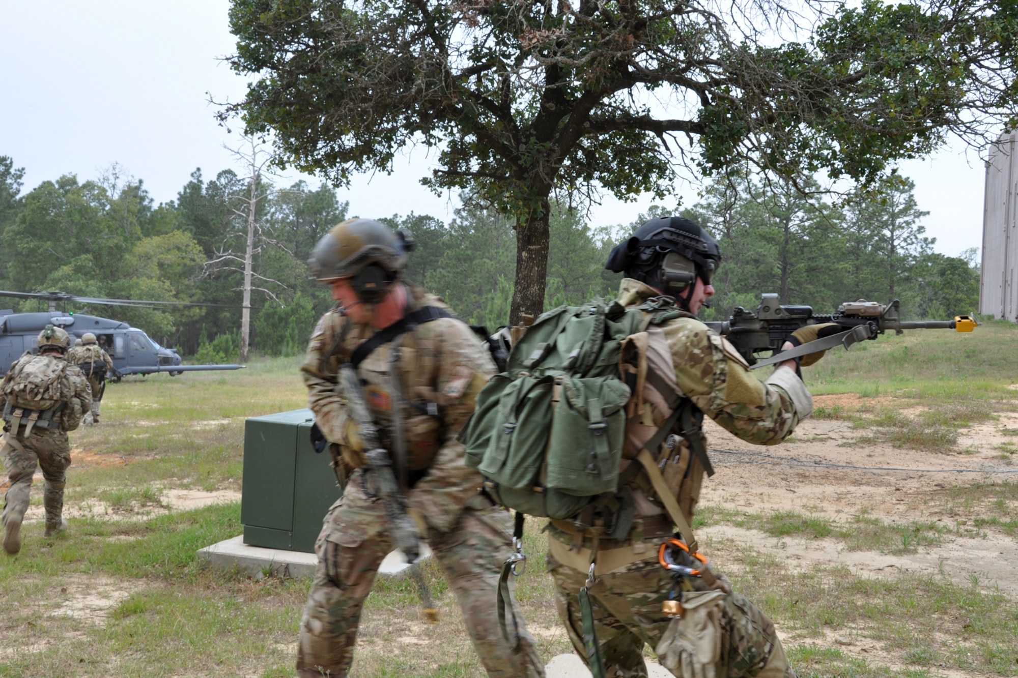 The last members of a 10-man team of pararescuemen assigned to the 920th Rescue Wing, Patrick Air Force Base, Fla., prepare to be extracted from a simulated village after a combat search and rescue (CSAR) mission at the Fort Polk Combined Arms Training Facility City Complex at Fort Polk La., May 15, 2012. The Airmen were part the Patriot Saint exercise, which is designed to hone their war fighting-skills for deployment. (U.S. Air Force photo by Master Sgt. Jeff Walston/Released)