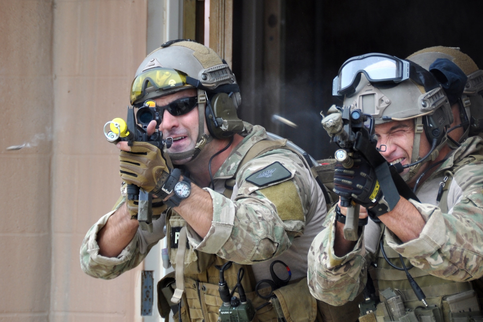 Pararescuemen assigned to the 920th Rescue Wing from Patrick Air Force Base, Fla., fire on OPFOR (Opposing Force) unit members during a combat search and rescue (CSAR) mission at the Fort Polk Combined Arms Training Facility City Complex at Fort Polk La., May 15, 2012. The Airmen were part of a combat search and rescue (CSAR) mission to rescue a soldier from hostile forces in support of the Patriot Saint exercise. (U.S. Air Force photo by Master Sgt. Jeff Walston/Released)