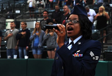 Senior Airman Petrice Brown, 628th Logisitics Readiness Squadron, sings the National Anthem during the Charleston RiverDogs Military Appreciation game May 17, 2012 at Charleston, S.C.  The Charleston RiverDogs hosted Military Appreciation night to show their support for the local military. (U.S. Air Force photo/Airman 1st Class Ashlee Galloway)