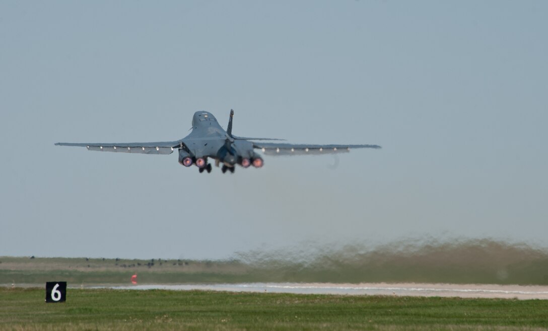 A B-1 bomber thunders toward the Utah Test and Training Range to employ six GBU-54 Laser Joint Direct Attack Munitions as part of a Combat Hammer exercise at Ellsworth Air Force Base, S.D., May 15, 2012. The LJDAM is a 500-pound, dual-mode guided weapon that is equipped with a laser seeker, which aids in its ability to engage both stationary and moving targets. (U.S. Air Force photo by Airman 1st Class Alystria Maurer/Released)