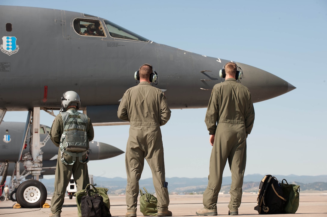 Aircrew from the 37th Bomb Squadron “Tigers” step out onto the flightline prior to take off during a Combat Hammer at Ellsworth Air Force Base, S.D., May 14, 2012. Aircrews from both the 37th and 34th Bomb Squadrons flew six GBU-54 Laser Joint Direct Attack Munitions with a group of six B-1 bombers into the Utah Test and Training Range for weapons evaluation. (U.S. Air Force photo by Airman 1st Class Zachary Hada/Released)