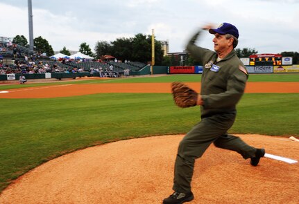 Chief Master Sgt. William Hamilton, 315th Operations Group superintendent, throws the first pitch during the Charleston RiverDogs Military Appreciation Night game May 17, 2012 at Charleston, S.C.  The Charleston RiverDogs hosted Military Appreciation night to show their support for the local military. (U.S. Air Force photo/Airman 1st Class Ashlee Galloway)