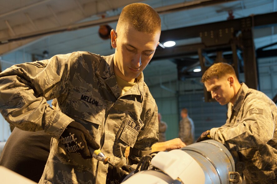 Airman 1st Class James Mellon, 28th Munitions Squadron conventional maintenance member, and Tech. Sgt. Vahn Chant, 28th MUNS conventional maintenance production manager, assembles a GBU-54 laser-guided Joint Direct Attack Munition as part of a training exercise at Ellsworth Air Force Base, S.D., April 18, 2012. Mellon and Chant joined other 28th MUNS technicians to build six GBU-54s to be dropped by 37th Bomb Squadron aircrews as part of a Combat Hammer exercise in May. (U.S. Air Force photo by Airman 1st Class Zachary Hada/Released)