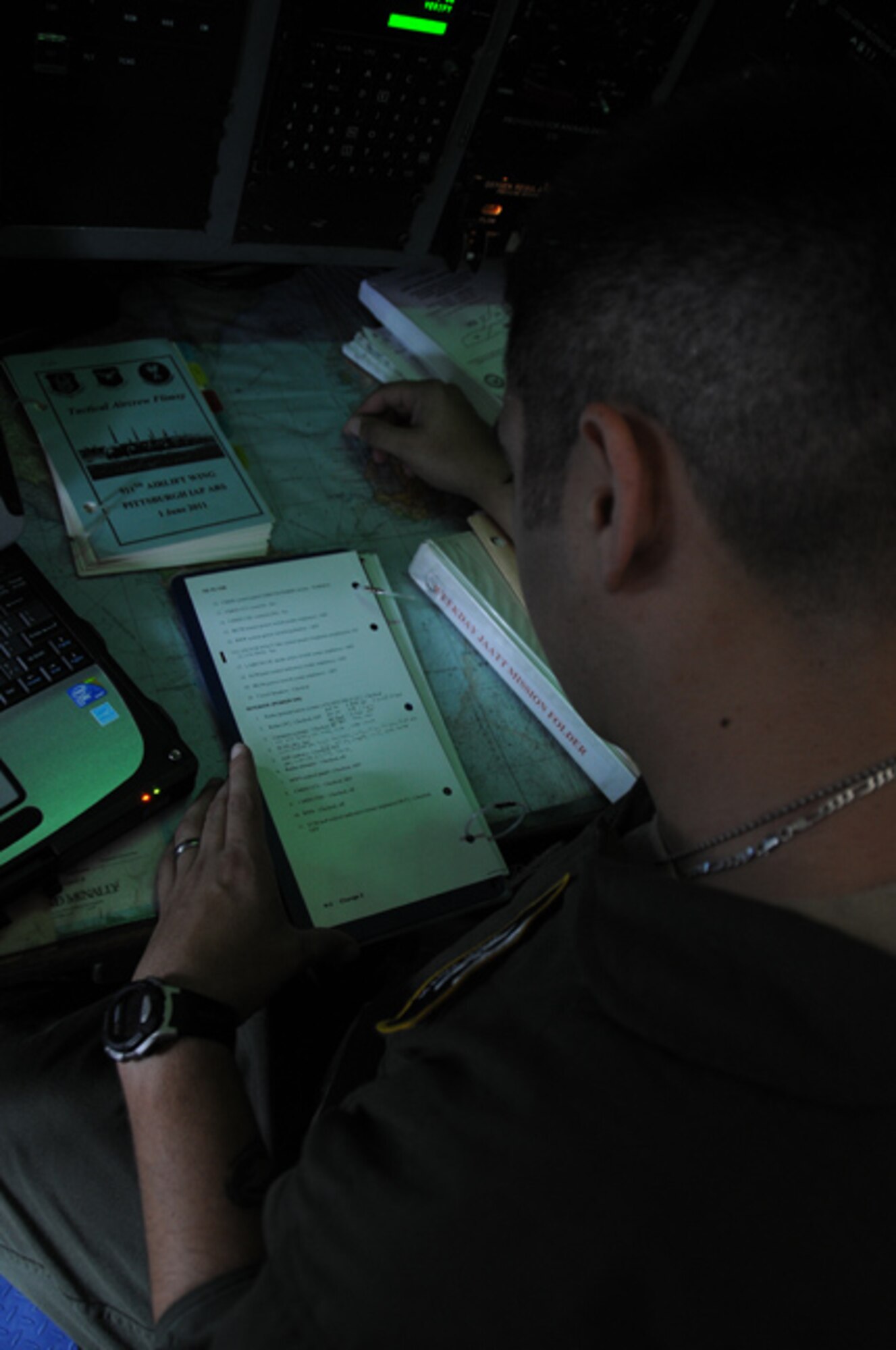 PITTSBURGH IAP ARS -- 1st Lt. Nick Hoth, 758th Airlift Squadron navigator, reviews a pre-flight checklist before taking flight on a training mission to Colorado, May 14, 2012. The training mission supports an Army Special Forces unit with Joint Airborne/Air Transportability Training.  Part of their training requires paratroopers to jump from a C-130H2 Hercules cargo aircraft. (U.S. Air Force photo by Senior Airman Joshua J. Seybert/Released)