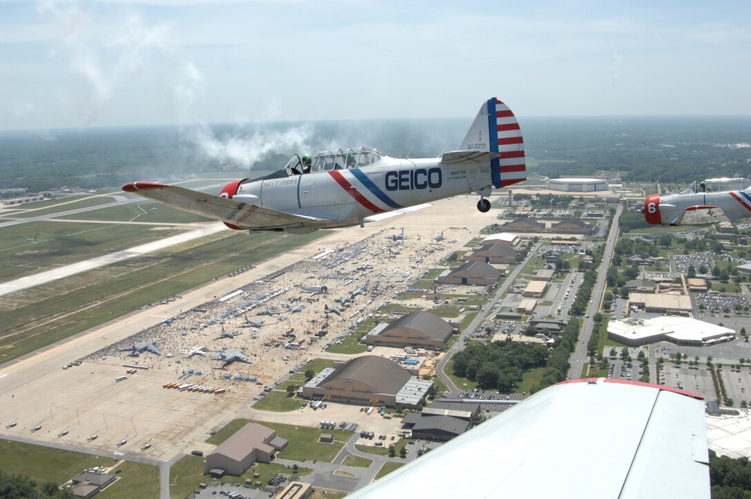 The Geico Skytypers perform over Joint Base Andrews in a vintage SNJ-2 aircraft during the 2012 Joint Service Open House & Air Show May 19. This year's JSOH celebrates the Centennial of Marine Corps Aviation. JSOH affords the public an opportunity to meet the men and women of the Armed Forces while viewing over 100 static displays and 19 aerial demonstration teams. (U.S. Air Force photo/Airman 1st Class Daniel Burkhardt)