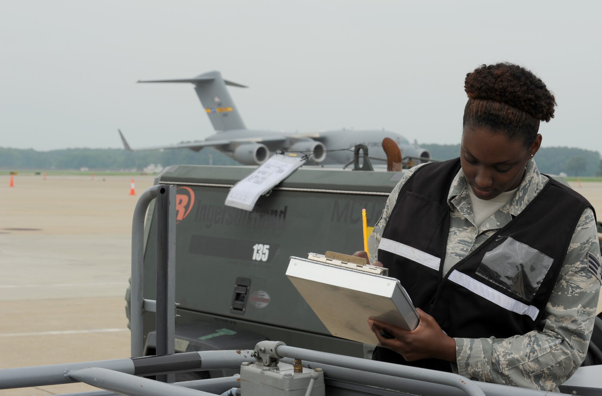 Senior Airman Tara Hall, 633rd Logistics Readiness Squadron joint inspection team air terminal inspector, evaluates equipment for air worthiness at Langley Air Force Base, Va., May 17, 2012. After the inspection, the equipment was loaded onto a C-17 Globemaster III for transport to a deployed location. (U.S. Air Force photo by Senior Airman Jarad A. Denton/Released)