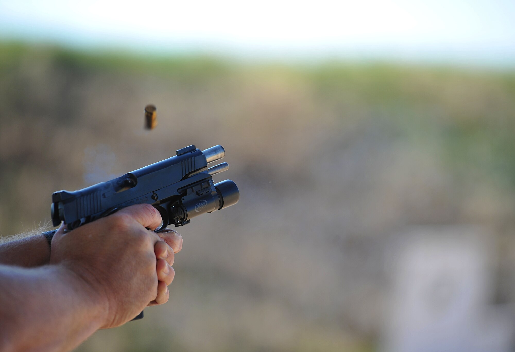 SAN ANGELO, Texas-- A 9mm Pistol is shot at the National Police Week Firearm Competition at the San Angelo Police Department Gun Range May 18. Each team was given a set time limit to shot several shots at a variety of distances to test their capabilities. (U.S. Air Force photo/Airman 1st Class Michael Smith)