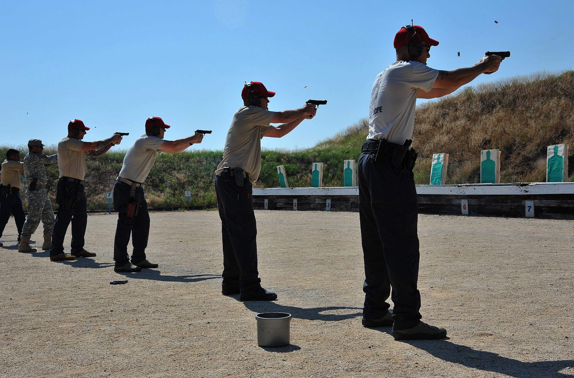 SAN ANGELO, Texas-- 17th Security Forces Squadron Combat Arms Training and Maintenance members shoot at targets during National Police Week Firearm Competition at the San Angelo Police Department Gun Range May 18. Each team was given a set time limit to shot several shots at a variety of distances to test their capabilities. (U.S. Air Force photo/Airman 1st Class Michael Smith)