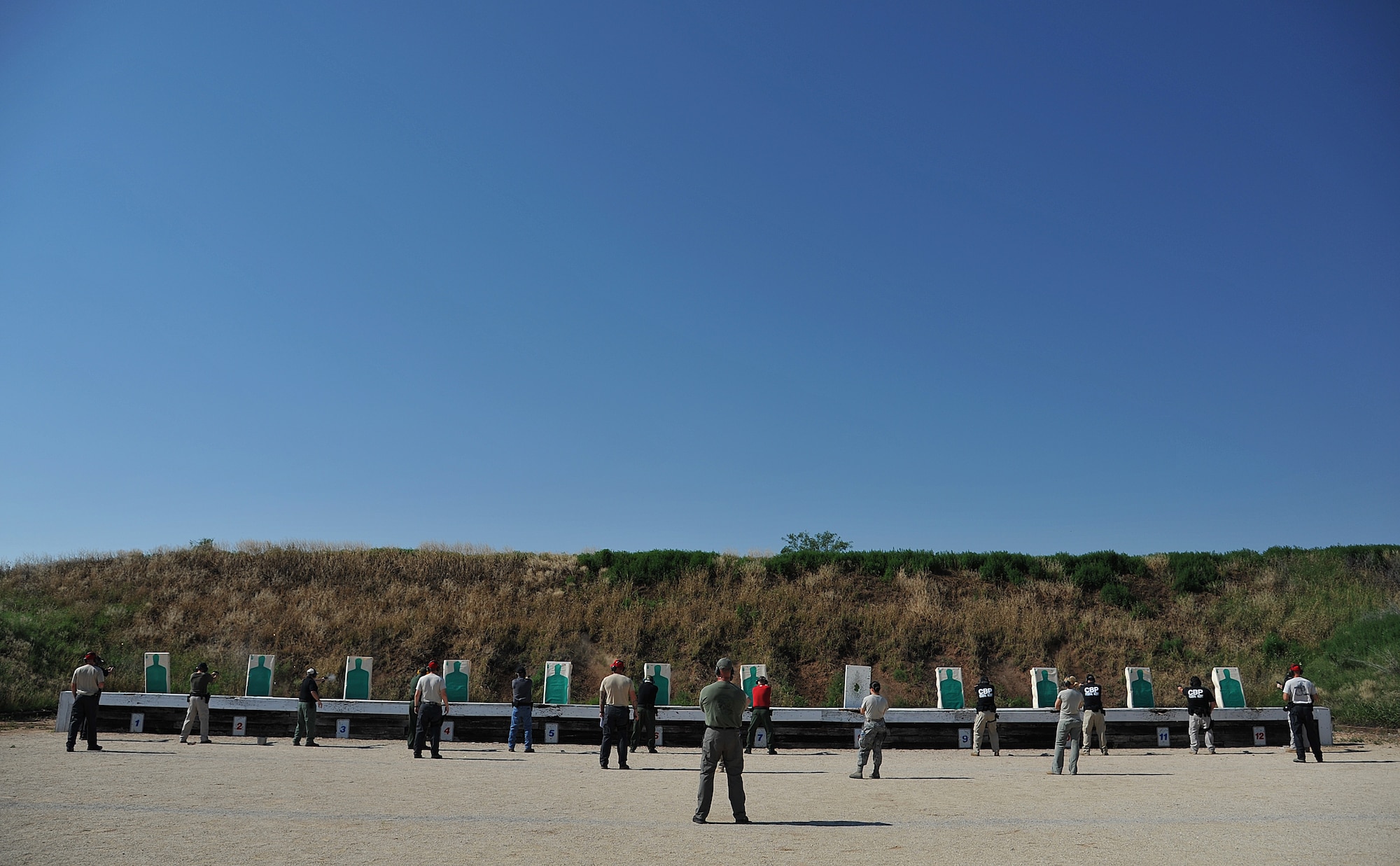 SAN ANGELO, Texas-- Participants shoot at targets during National Police Week Firearm Competition at the San Angelo Police Department Gun Range May 18. Each team was given a set time limit to shot several shots at a variety of distances to test their capabilities. (U.S. Air Force photo/Airman 1st Class Michael Smith)