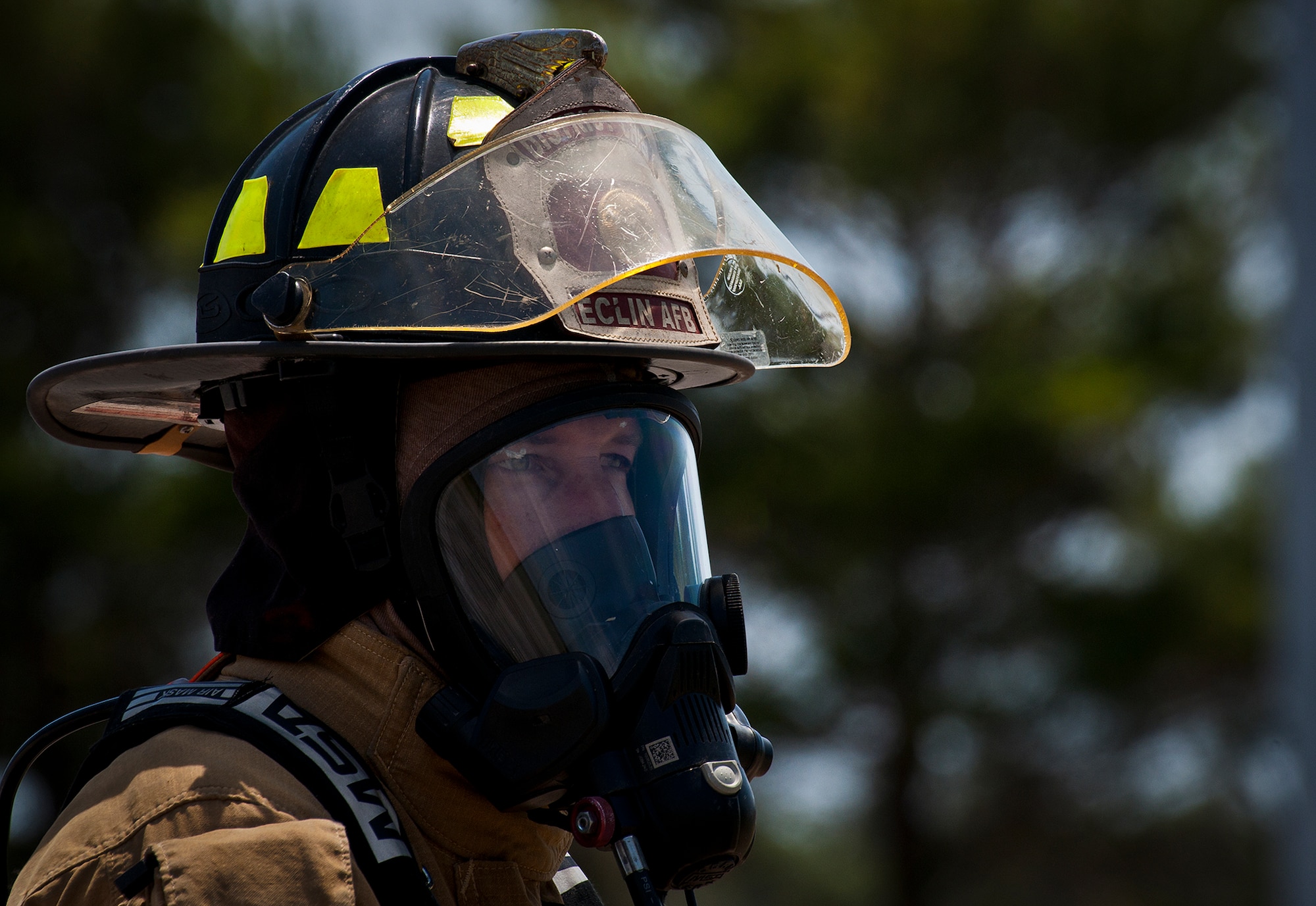Chief J.R. Suddarth, of the 96th Civil Engineer Squadron, scans the area before giving the order to begin the live-fire exercise at Eglin Air Force Base, Fla.  The aircraft fire training is a yearly requirement for Eglin’s Airmen and civilian firefighters.  The firefighters must battle a fire on the inside and outside of the aircraft to complete the training.  (U.S. Air Force photo/Samuel King Jr.)