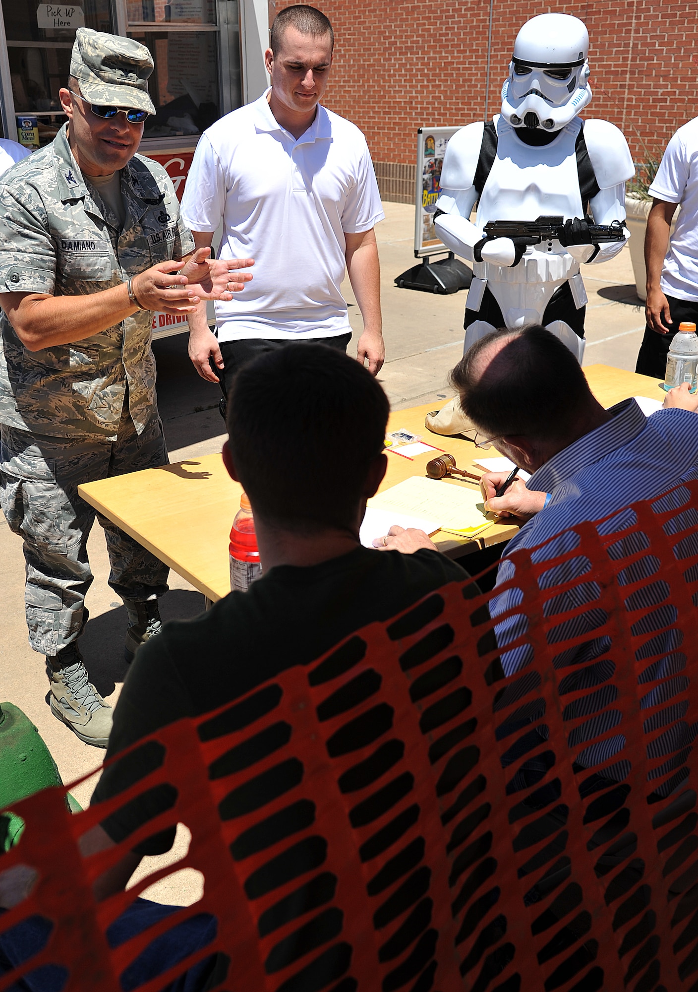 GOODFELLOW AIR FORCE BASE, Texas-- Col. Mark Damiano, 17th Training Wing Commander, attempts to argue his case to the mock judge during the Jail-N-Bail fundraiser set up by 17th Security Forces Squadron May 17.Team Goodfellow members had the ability to put each other in the simulated jail cell during National Police Week for up to an hour. (U.S. Air Force photo/ Airman 1st Class Michael Smith)