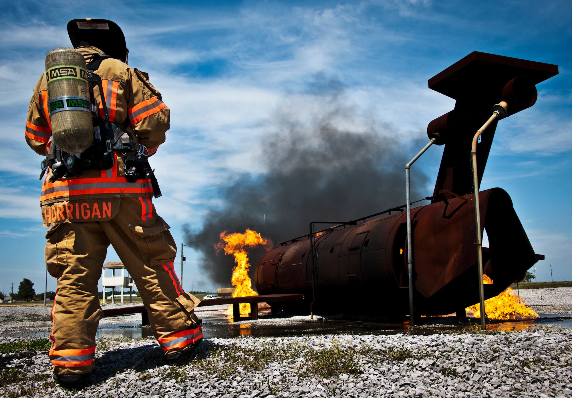 Sean Horrigan, of the 96th Civil Engineer Squadron, ensures the aircraft burners ignite prior to a live-fire exercise at Eglin Air Force Base, Fla.  The aircraft fire training is a yearly requirement for Eglin’s Airmen and civilian firefighters. The firefighters must battle a fire on the inside and outside of the aircraft to complete the training.   (U.S. Air Force photo/Samuel King Jr.)