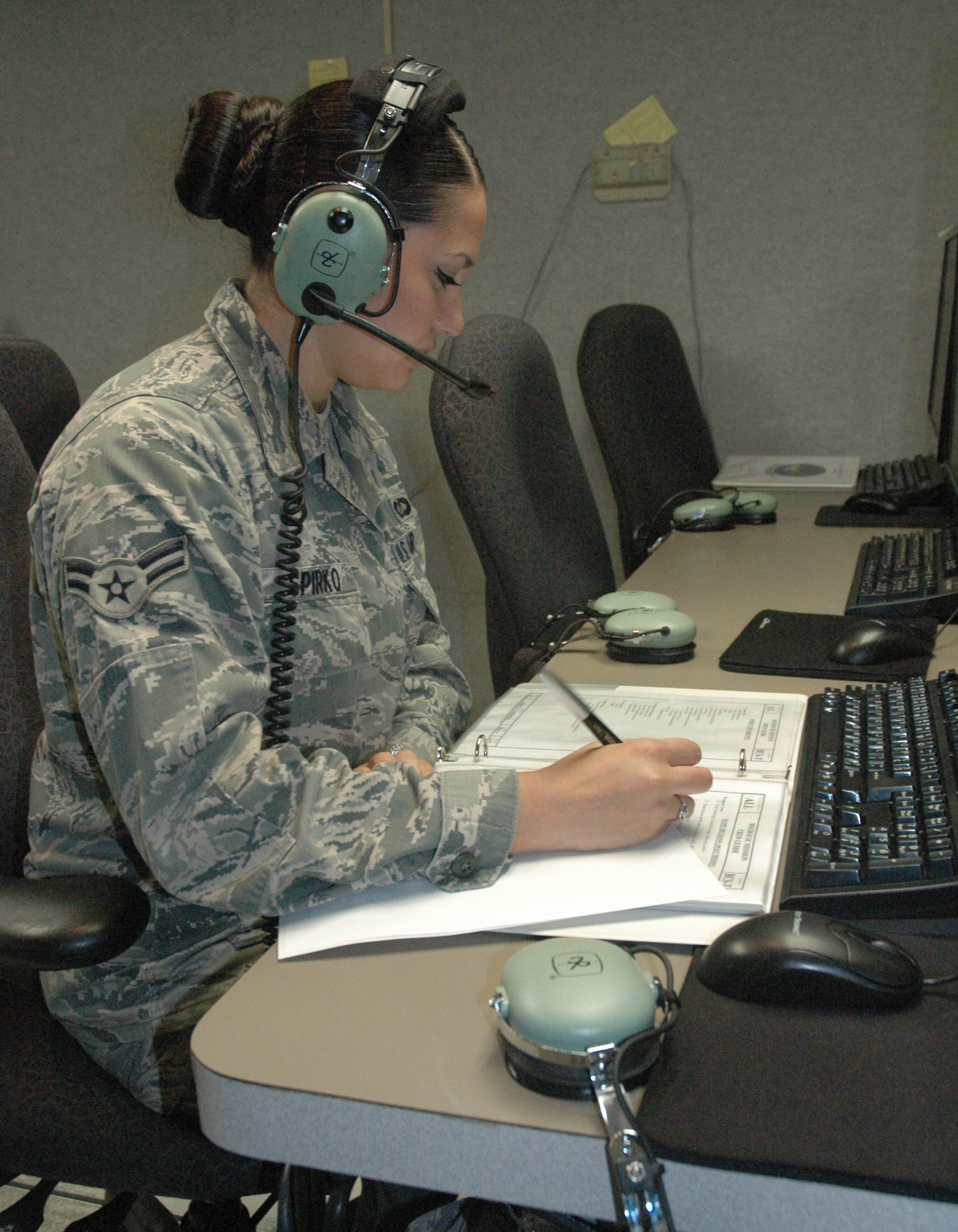 Senior Airman Joyce Spirko, 325th Air Command Squadron pilot simulator and weapons technician, performs her duties on while on scope. She earned the 2011 Command and Control Battle Management Operator of the Year Award. (Courtesy photo)