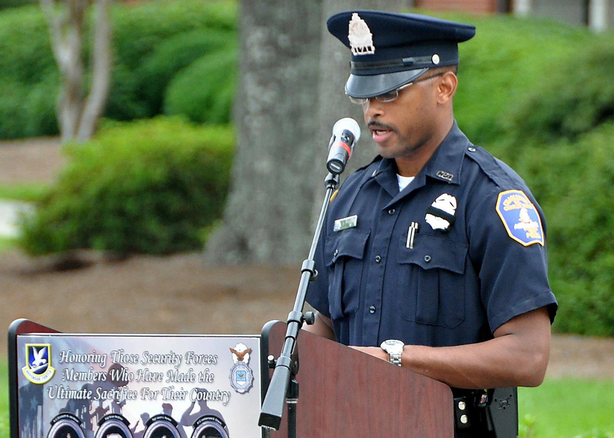 Tech. Sgt. Ulysius Vance, 315th Security Forces Squadron also an officer with the Charleston Police Department, reads names of South Carolina's fallen law enforcement officers during the Joint Base Charleston 2012 National Police Week memorial retreat ceremony at the base flagpole May 18, 2012 (U.S. Air Force photo / Michael Dukes)