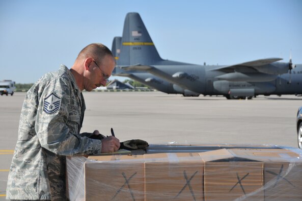Master Sgt. Stephen Johnson, 153rd Logistics Readiness Squadron air transportation craftsman, prepares pallets of simulated vaccine as part of a Strategic National Stockpile exercise May 14, 2012, at the Wyoming Air National Guard base, Cheyenne, Wyo. Airmen assigned to the Wyoming Air National Guard worked with multiple state agencies to test abilities to receive, deliver and distribute medical supplies to various parts of the state. (U.S. Air Force photo by 1st Lt. Rusty Ridley)