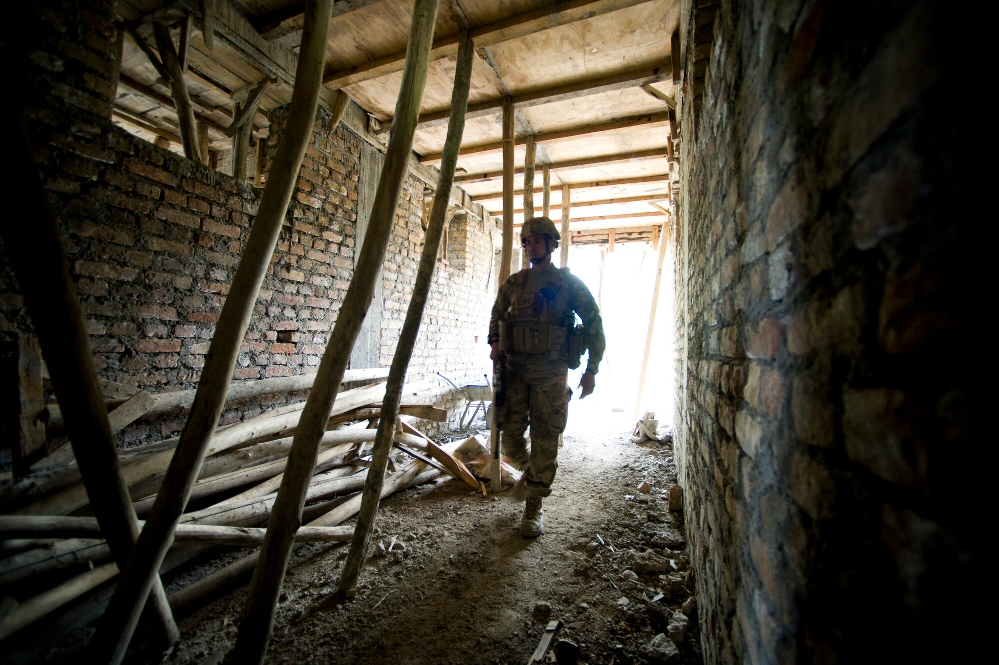 U.S. Air Force Lt. Col. Eric Shafa with Provincial Reconstruction Team Kapisa walks down a hallway of a local school that's under construction, Kapisa Province, May 17, 2012. The Kapisa PRT is a U.S. military team that engages with local leaders and contractors to plan and inspect development projects in the province. (U.S. Air Force photo by Staff Sgt. Greg C. Biondo)(Released)