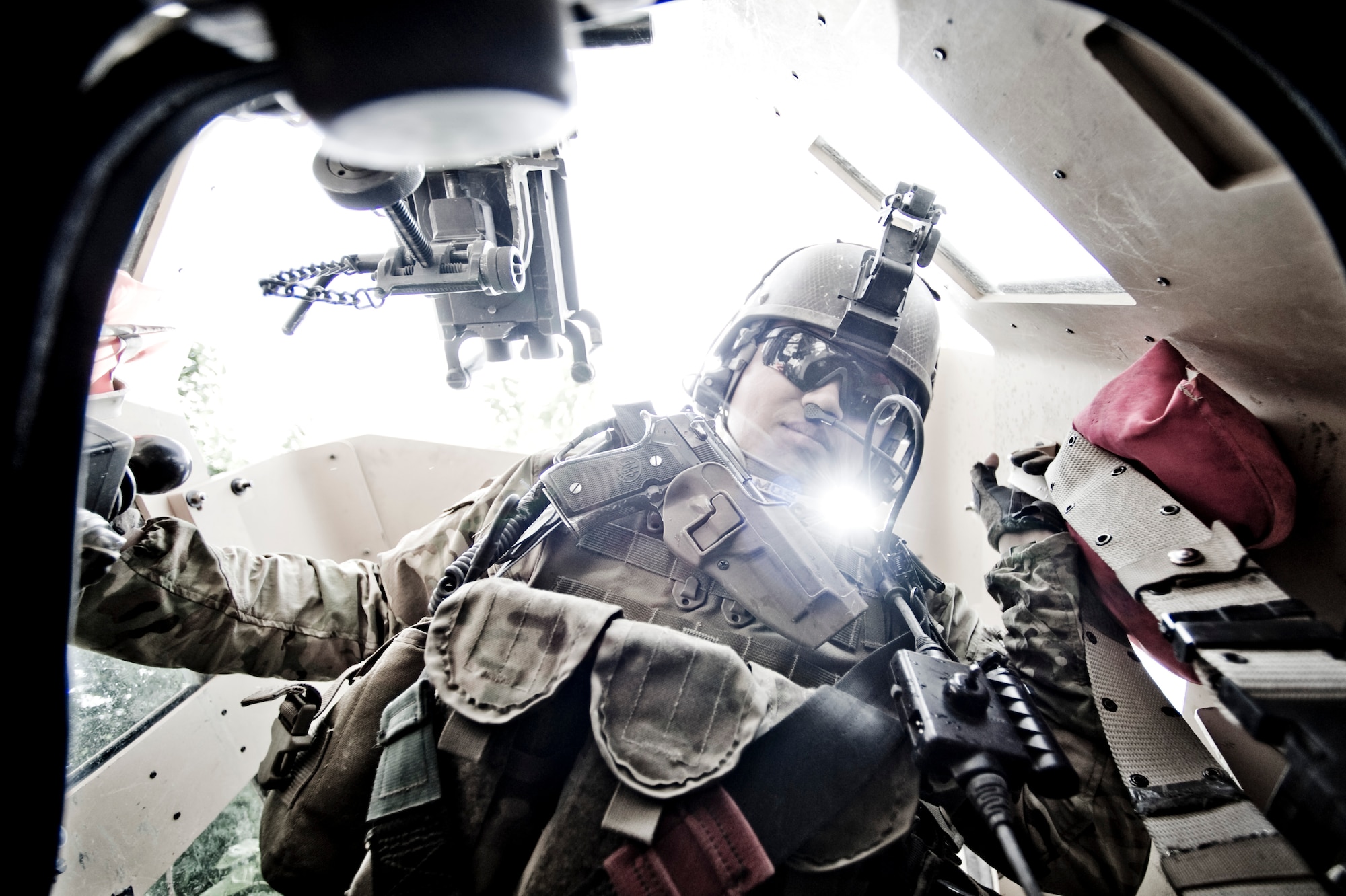 U.S. Army Cpl. Jesse Ramos with Provincial Reconsruction Team Kapisa provides over-watch for a convoy as a turret gunner, Kapisa Province, Afghanistan, May 17, 2012. The Kapisa PRT is a U.S. military team that engages with local leaders and contractors to plan and inspect development projects in the province. (U.S. Air Force photo by Staff Sgt. Greg C. Biondo)(Released)