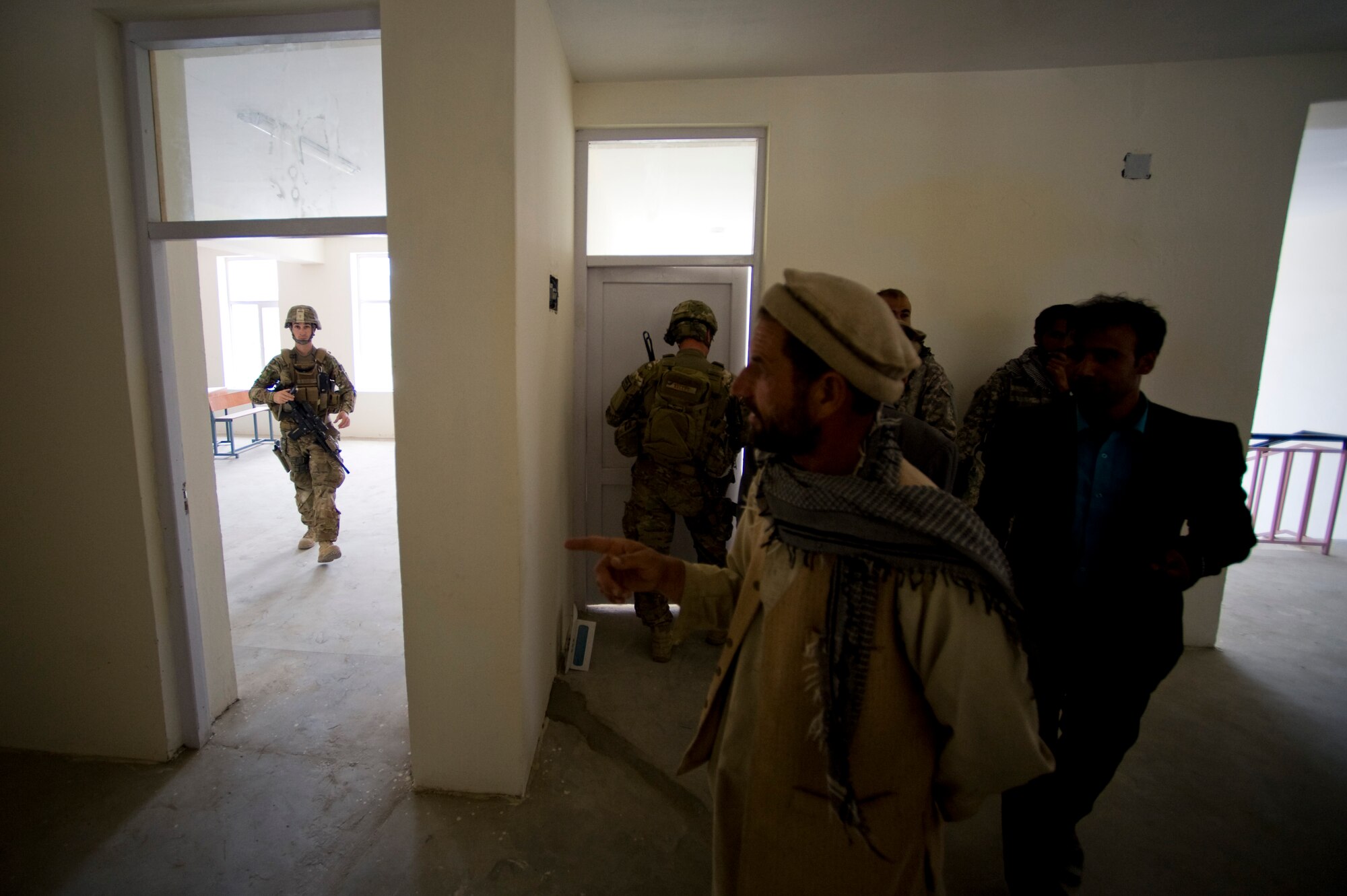 U.S. Air Force Tech. Sgt. Richard Love with Provincial Reconstruction Team Kapisa, walks out of a room after inspecting it at a local school, Kapisa Province, Afghanistan, May 15, 2012. The Kapisa PRT is a U.S. military team that engages with local leaders and contractors to plan and inspect development projects in the province. (U.S. Air Force photo by Staff Sgt. Greg C. Biondo)(Released)