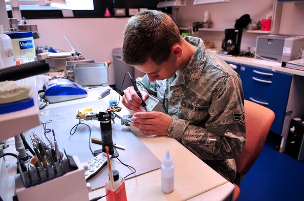 U.S. Air Force Airman 1st Class Collin Casey, 20th Dental Squadron dental lab technician, constructs a night guard at Shaw Air Force Base, S.C., May 15, 2012.  (U.S. Air Force photo by Airman Nicole Sikorski/Released)  

