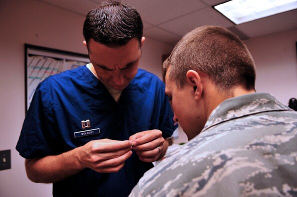 U.S. Air Force Capt. Christopher Wolbert, 20th Dental Squadron dentist, oversees the progress on the construction of a gold crown for his patient at Shaw Air Force Base, S.C., May 15, 2012.(U.S. Air Force photo by Airman Nicole Sikorski/Released) 
