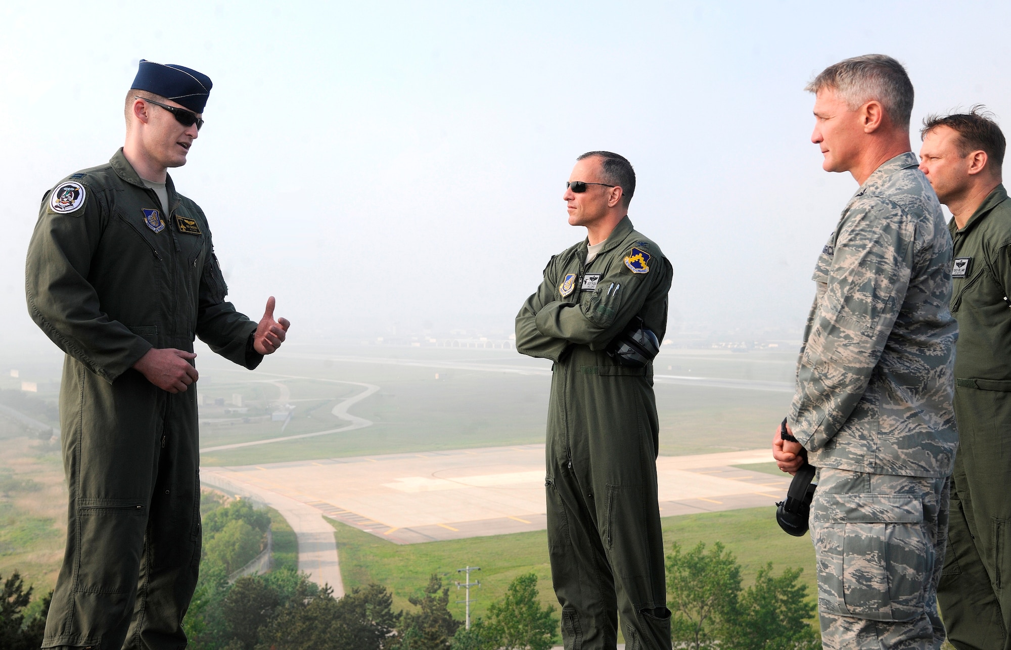 Captain Richard Smeeding, 80th Fighter Squadron pilot, briefs Col. John W. Pearse, 8th Fighter Wing commander, at Big Coyote hill on Kunsan Air Base, Republic of Korea on May 16, 2012.  Pearse received a mission brief of the Wolf Pack followed by a demonstration by the 8th Security Forces Squadron on how they defend the base. (U.S. Air Force photo/Staff Sgt. Rasheen Douglas) 