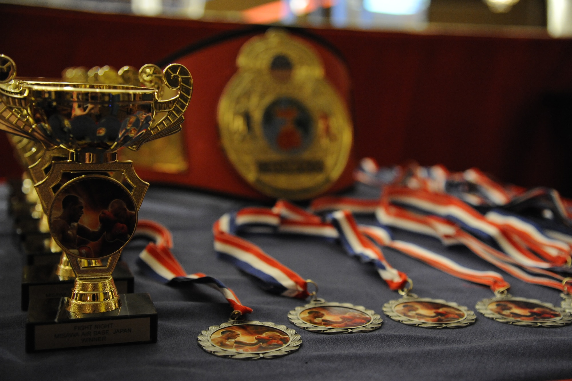 The collocated club hosted an amateur boxing event, sponsored by the 35th Force Support Squadron, at Misawa Air Base, Japan, May 18, 2012. Match winners won a trophy, while losing participants received a medallion for their efforts. A total of 38 participants fought at the event. (U.S. Air Force photo by Tech. Sgt. Marie Brown/Released)