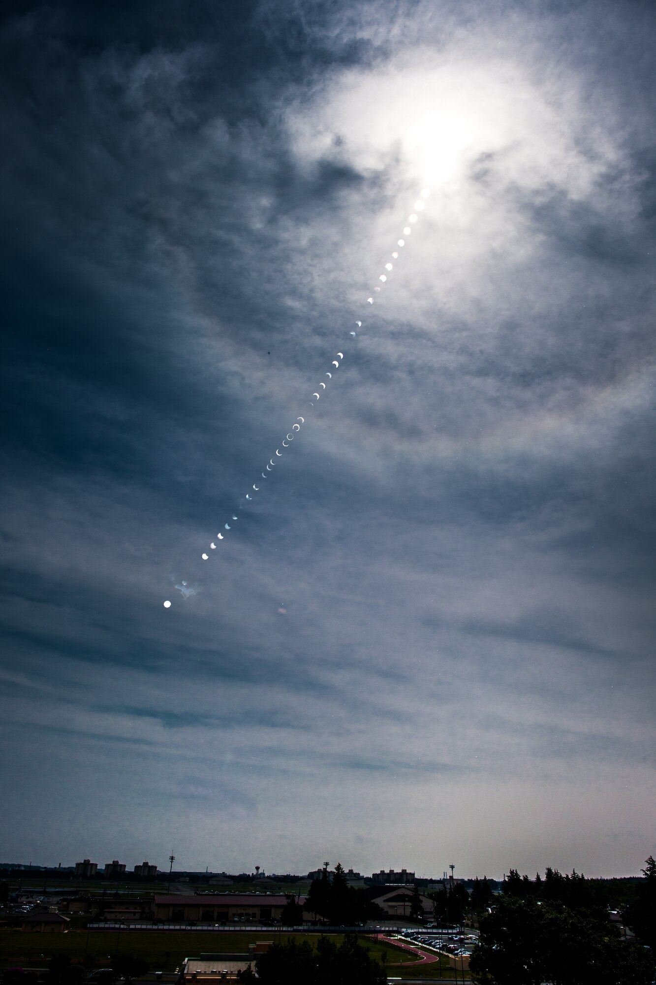 YOKOTA AIR BASE, Japan -- The annular solar eclipse occurs on the morning of May 21, 2012 for the first time in 173 years in the Tokyo metropolitan area. The annular eclipse was visible as it moved across eastern Asia, the northern Pacific Ocean and the western United States.  (U.S. Air Force photo illustration by Osakabe Yasuo)