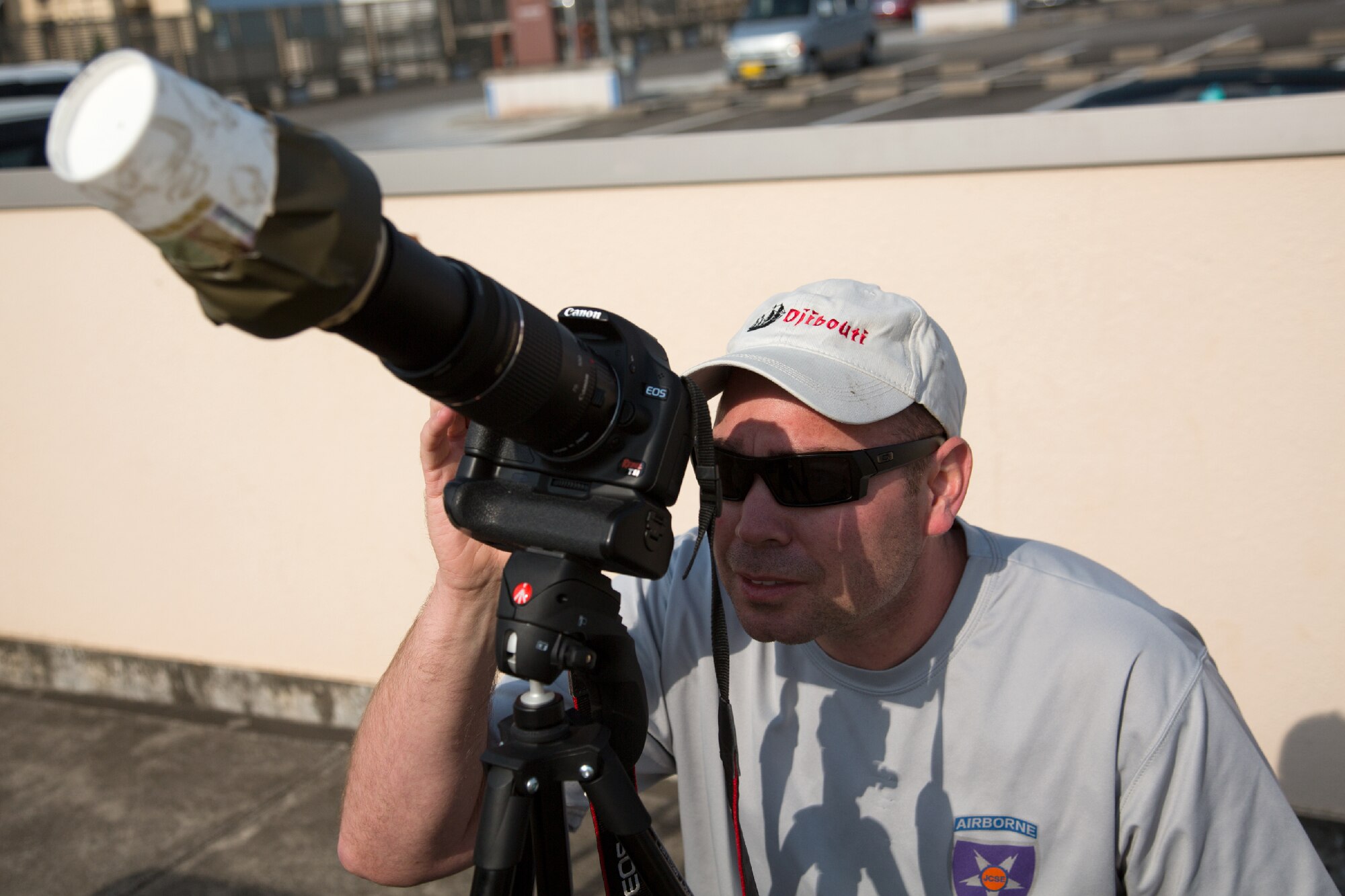 YOKOTA AIR BASE, Japan -- Master Sgt. Brian Mann, Defense Media Activity-Pacific, pacific theater maintenance superintendent, captures the annular solar eclipse with his custom-made pinhole filter at Yokota Air Base, Japan, May 21, 2012. The eclipse stretched from Southeast Asia across the Pacific Ocean to western parts of North America. (U.S. Air Force photo by Osakabe Yasuo)