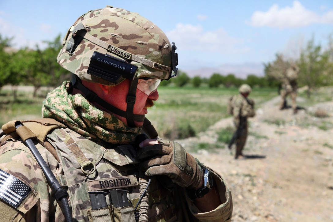 U.S. Army 1st Lt. Robert Rushton communicates to his platoon sergeant on his radio at the Khoshi District Center in Afghanistan’s Logar province, May 12, 2012. Rushton is assigned to the 201st Georgia Agribusiness Development Team 2.