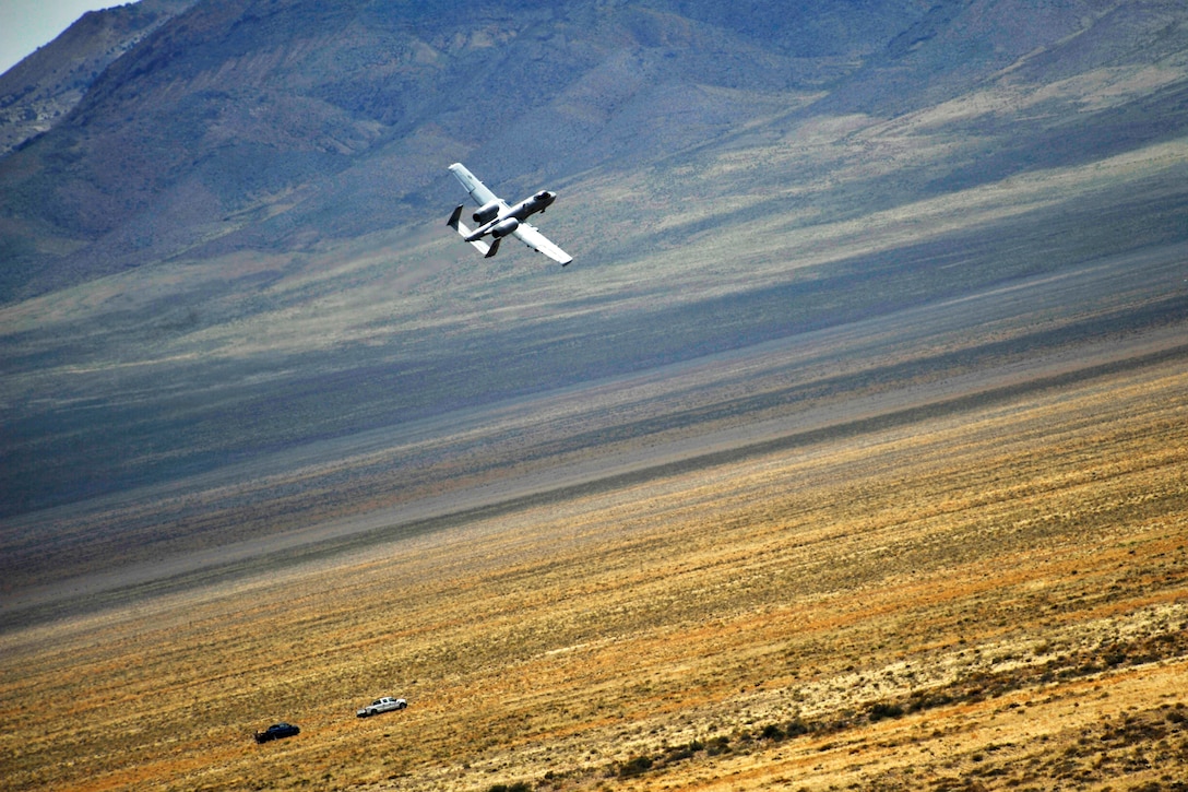 A U.S. Air Force A-10 Warthog searches for a downed pilot during training for combat search and rescue from the Air Force Weapons School near Nellis Air Force Base, Nev., May 17, 2012. The air craft pilot is assigned to the 66th Weapons Squadron.